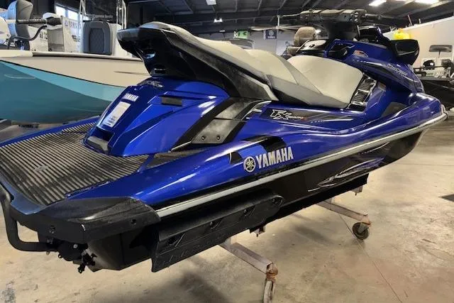 Slide: The Image of 2014 Yamaha WaveRunner FX Cruiser HO in a showroom, blue and black design. - 9