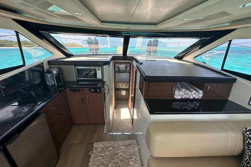 Slide: The Image of Luxurious interior of 2017 Carver C40 yacht with modern kitchen and ocean view. - 5