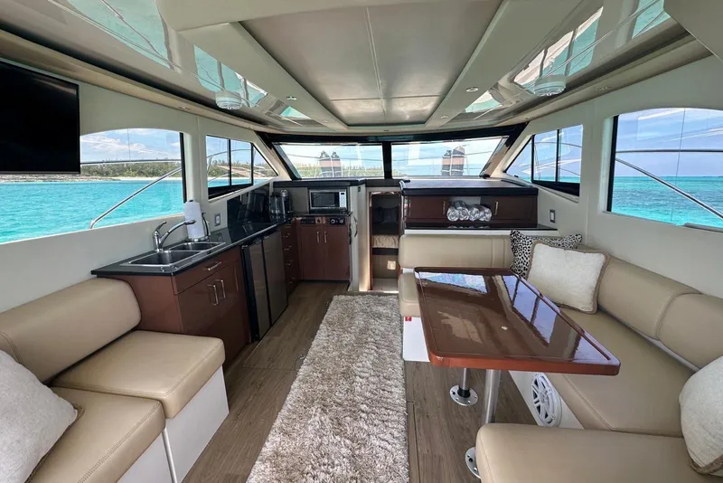 Slide: The Image of Luxurious interior of 2017 Carver C40 yacht with modern kitchen and seating area. - 9