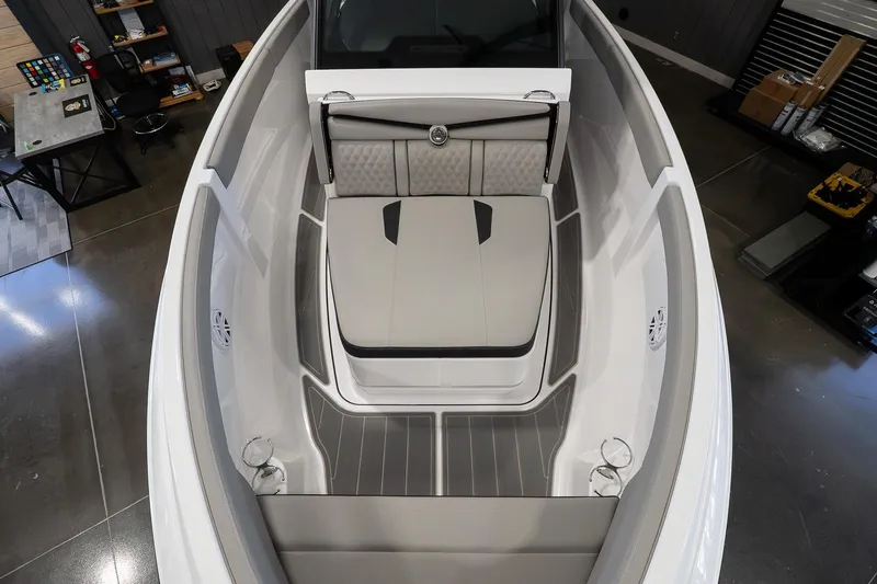 Slide: The Image of 2026 Monterey Elite 25 OB boat interior with sleek seating and modern design. - 13