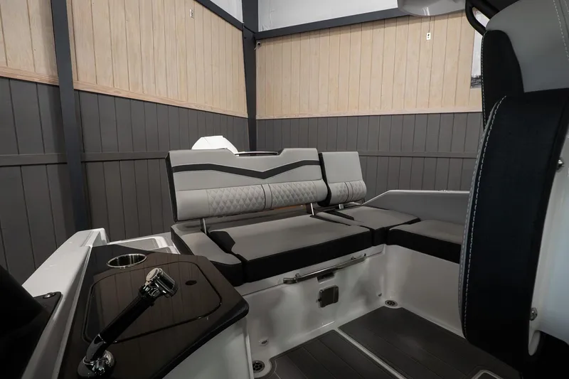 Slide: The Image of 2026 Monterey Elite 25 OB boat interior with sleek seating and modern design. - 8