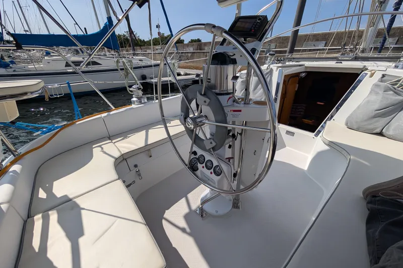 Slide: The Image of Cockpit of a 2004 Catalina 310 sailboat with steering wheel and navigation instruments. - 29