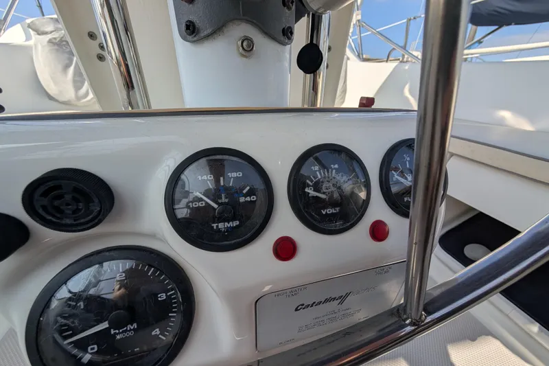 Slide: The Image of Dashboard of a 2004 Catalina 310 sailboat with gauges and controls. - 33