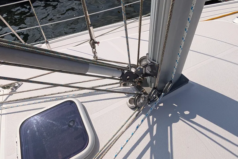 Slide: The Image of Deck rigging of a 2004 Catalina 310 sailboat with ropes and pulleys. - 39