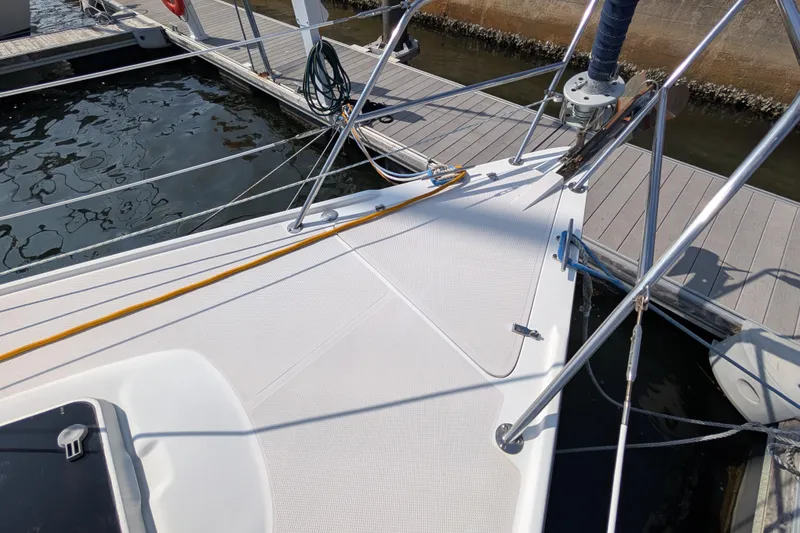 Slide: The Image of Deck of a 2004 Catalina 310 sailboat docked at a marina. - 41