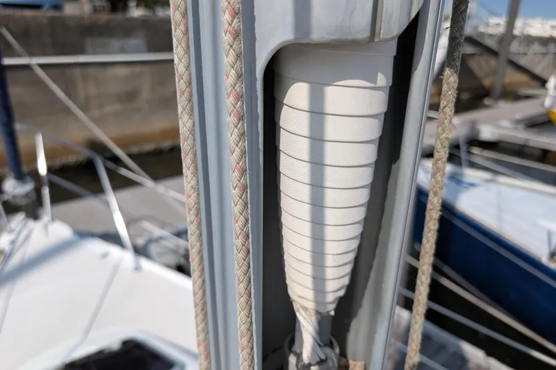 Slide: The Image of Close-up of a 2004 Catalina 310 sailboat mast with rigging details. - 44