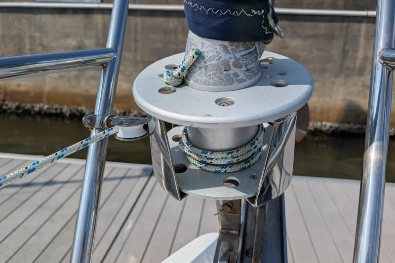 Slide: The Image of Close-up of Catalina 310 sailboat winch system, 2004 model, with rope and metal fittings. - 45