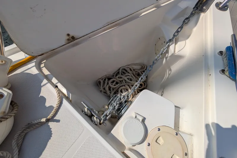 Slide: The Image of Anchor locker of a 2004 Catalina 310 sailboat with rope and chain. - 47