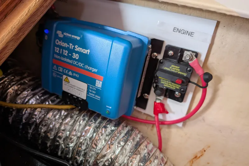 Slide: The Image of DC/DC charger and circuit breaker in a 2004 Catalina 310 engine compartment. - 52