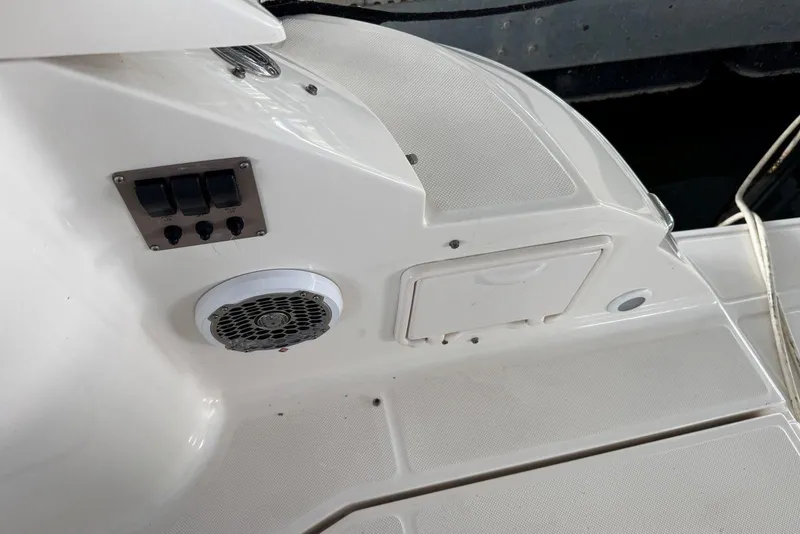 Slide: The Image of 2005 Regal 3360 Window Express boat interior with speaker and control panel. - 14