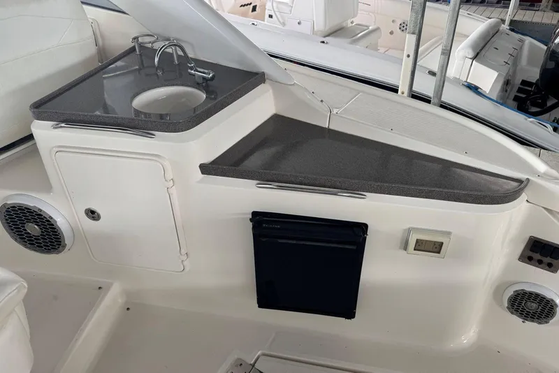 Slide: The Image of 2005 Regal 3360 Window Express boat interior with sink and counter area. - 15