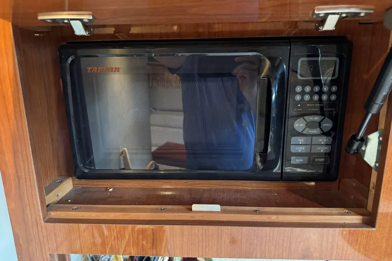 Slide: The Image of Tappan microwave in 2005 Regal 3360 Window Express boat kitchen cabinet. - 31