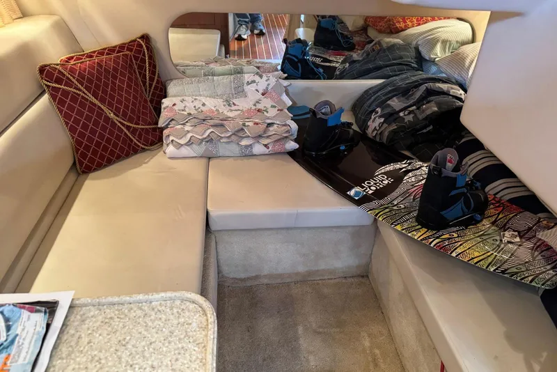 Slide: The Image of Interior of 2005 Regal 3360 Window Express with wakeboard and cozy seating area. - 33