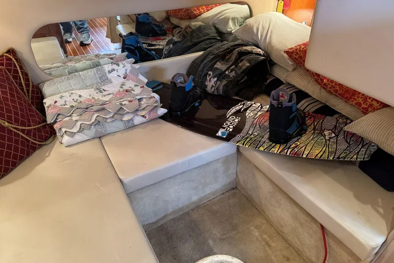 Slide: The Image of Interior of 2005 Regal 3360 Window Express with wakeboard and bedding on seats. - 35