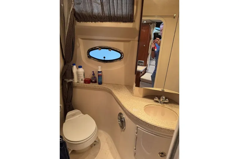 Slide: The Image of 2005 Regal 3360 Window Express bathroom with sink, toilet, and toiletries. - 38