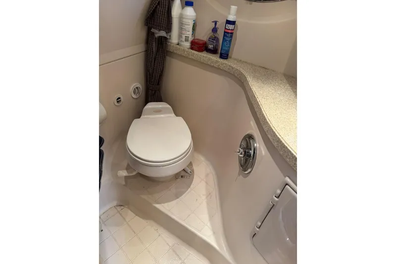 Slide: The Image of 2005 Regal 3360 Window Express boat bathroom with toilet and countertop essentials. - 39