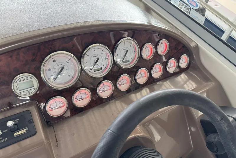 Slide: The Image of Dashboard of 2005 Regal 3360 Window Express boat with gauges and controls. - 40