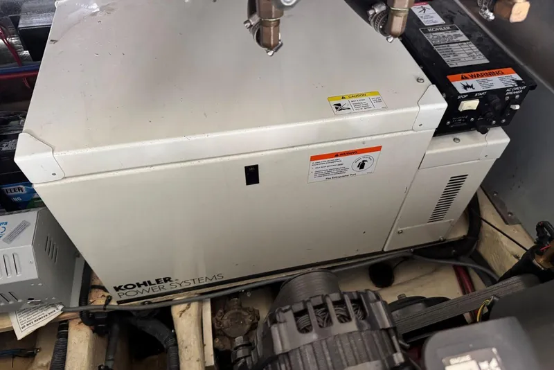 Slide: The Image of Kohler power system in 2005 Regal 3360 Window Express engine compartment. - 43