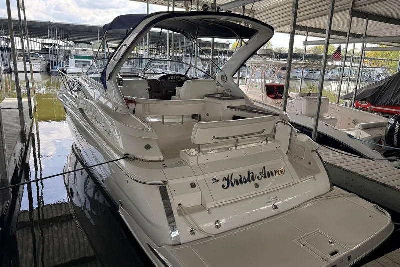 Slide: The Image of 2005 Regal 3360 Window Express boat docked in marina, rear view. - 5