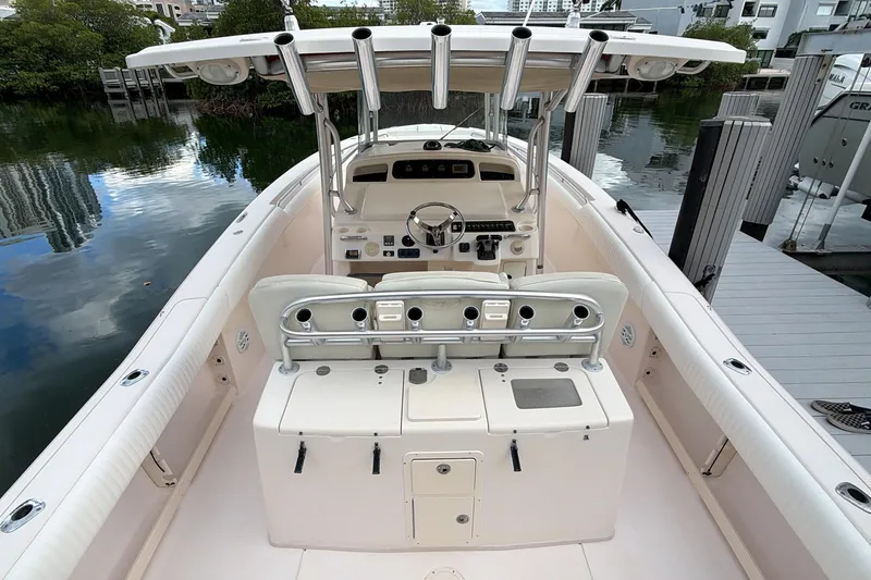Slide: The Image of 2010 Grady-White Canyon 336 boat storage compartment with open lid and hydraulic support. - 22