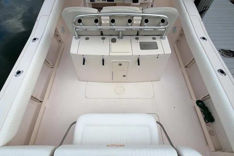 Slide: The Image of 2010 Grady-White Canyon 336 boat interior with helm and seating area. - 23
