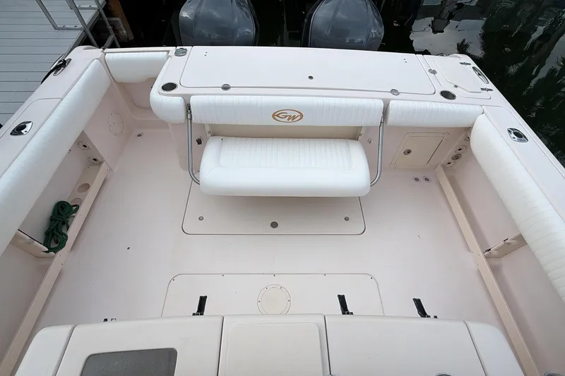 Slide: The Image of 2010 Grady-White Canyon 336 boat interior with seating and storage compartments. - 24