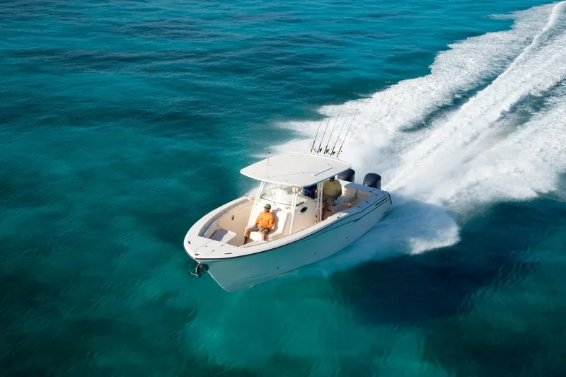 Slide: The Image of 2010 Grady-White Canyon 336 boat interior with seating and storage compartments. - 26