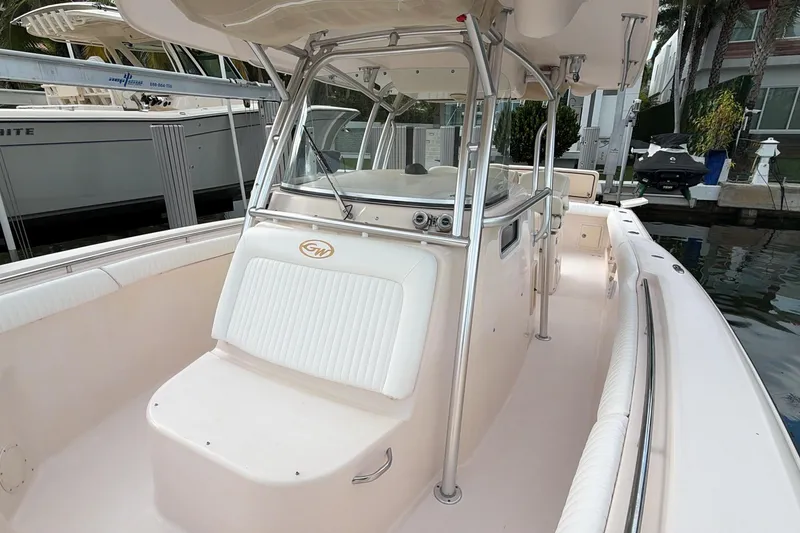 Slide: The Image of 2010 Grady-White Canyon 336 boat interior with seating and stainless steel railings. - 32