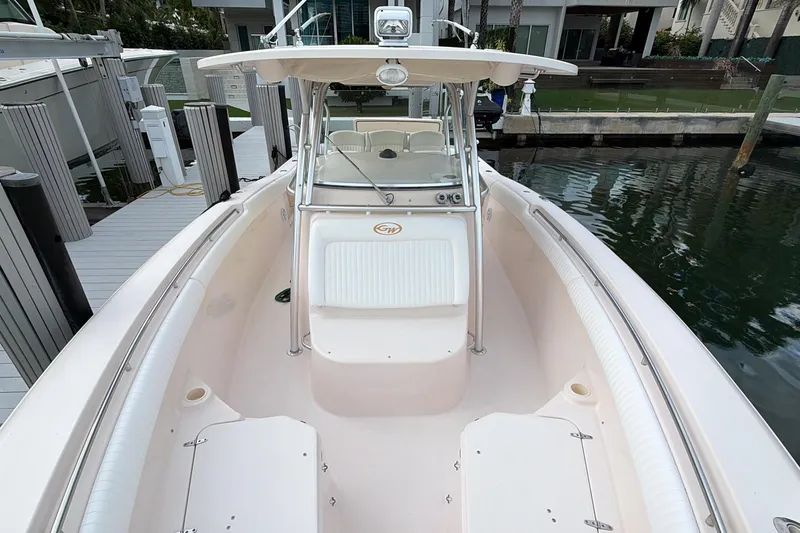 Slide: The Image of 2010 Grady-White Canyon 336 boat interior with seating and helm station. - 33