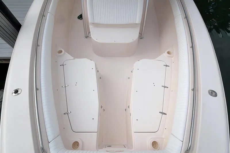 Slide: The Image of 2010 Grady-White Canyon 336 boat docked, showcasing spacious deck and seating area. - 34