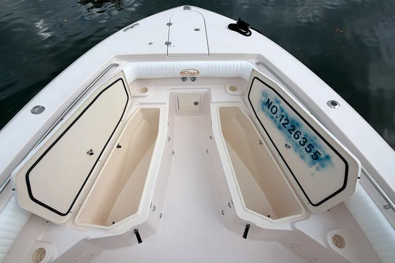 Slide: The Image of 2010 Grady-White Canyon 336 boat interior with seating and storage compartments. - 35