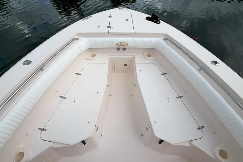 Slide: The Image of 2010 Grady-White Canyon 336 boat deck with open storage compartments. - 36