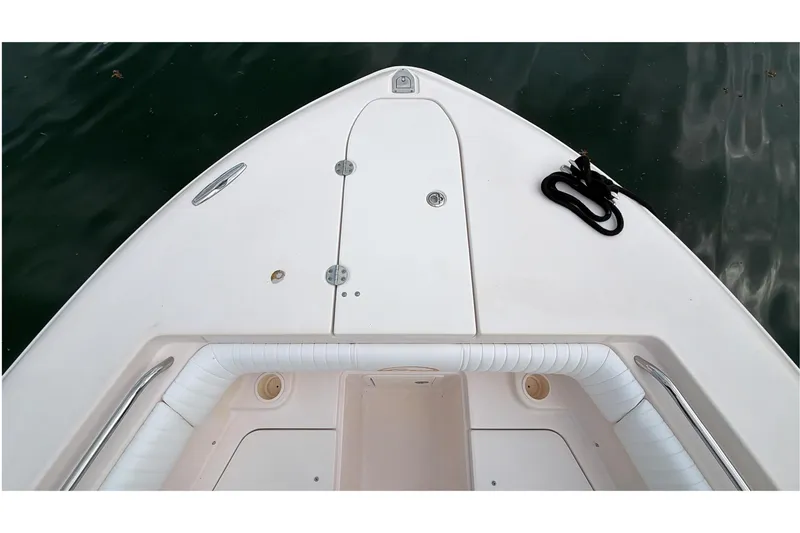 Slide: The Image of 2010 Grady-White Canyon 336 boat bow with anchor storage and seating. - 38