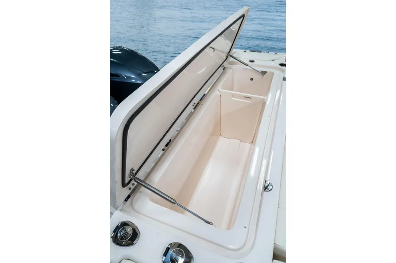 Slide: The Image of 2010 Grady-White Canyon 336 boat interior with seating and storage compartments. - 6