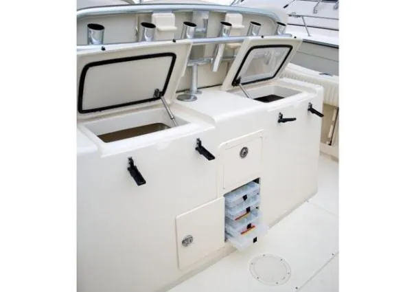 Slide: The Image of 2010 Grady-White Canyon 336 boat interior with open door revealing compact restroom. - 7