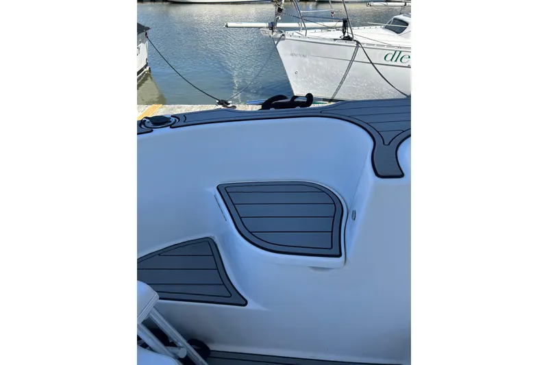 Slide: The Image of 2007 Meridian 411SB boat deck with sleek design and water view. - 11