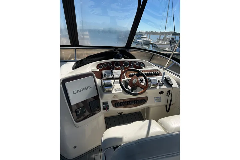 Slide: The Image of 2007 Meridian 411SB yacht helm with Garmin navigation, docked at marina. - 19
