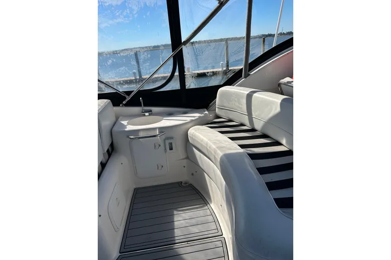 Slide: The Image of Interior of 2007 Meridian 411SB yacht with white seating and striped cushions. - 20