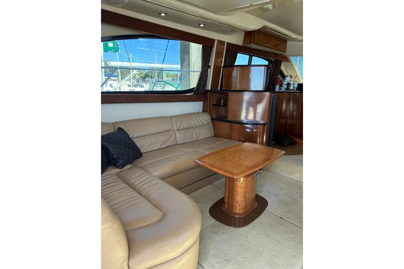 Slide: The Image of Luxurious interior of 2007 Meridian 411SB yacht with leather seating and wooden table. - 28