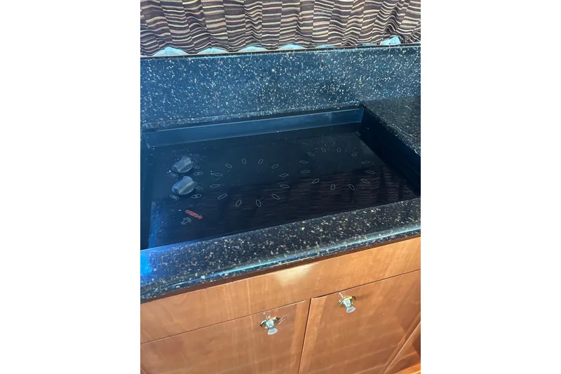 Slide: The Image of Kitchen area in a 2007 Meridian 411 Sedan boat. - 34