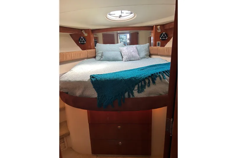 Slide: The Image of Luxurious bedroom interior of 2007 Meridian 411SB yacht with cozy bedding and elegant wood finish. - 40