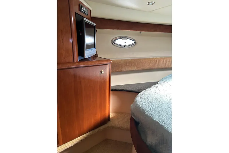 Slide: The Image of Interior of 2007 Meridian 411SB yacht with wood cabinetry and small window. - 42