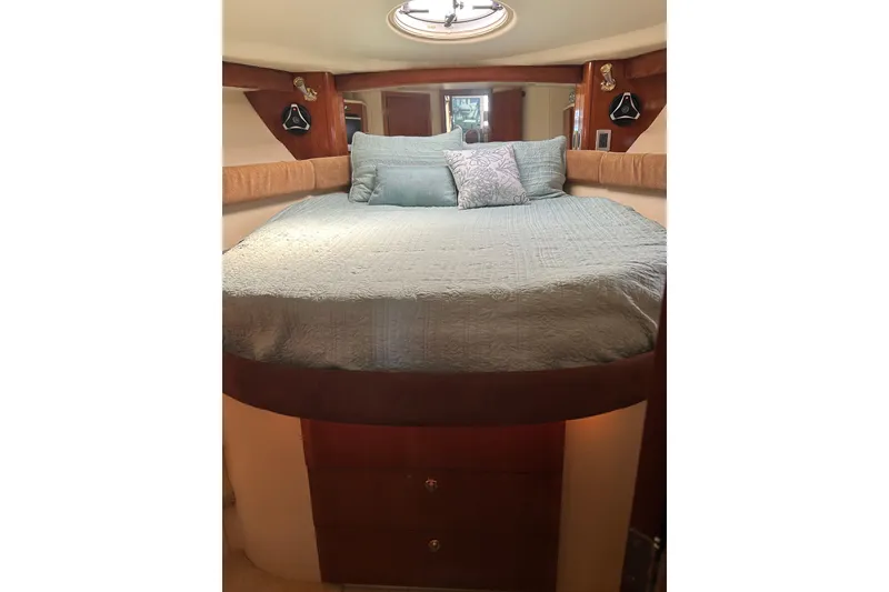 Slide: The Image of Cozy bedroom interior of 2007 Meridian 411SB yacht with elegant bedding and wood accents. - 44