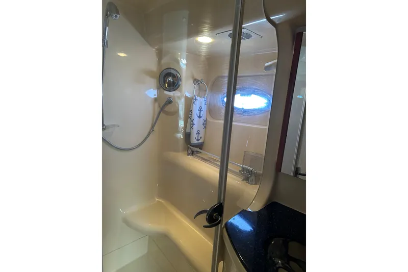 Slide: The Image of Luxurious bathroom in 2007 Meridian 411SB yacht with shower and nautical decor. - 45