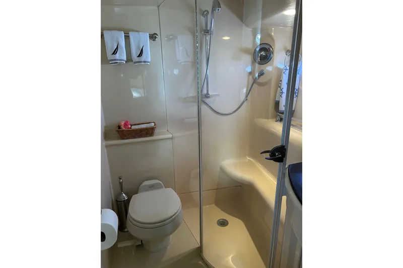 Slide: The Image of Compact bathroom in 2007 Meridian 411SB yacht with shower, toilet, and towel rack. - 47