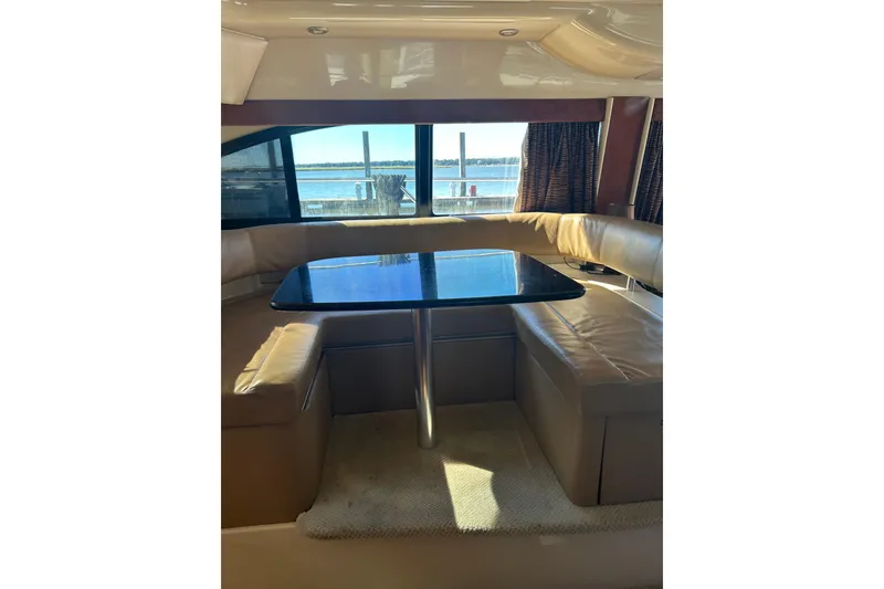 Slide: The Image of Luxurious interior of 2007 Meridian 411SB yacht with leather seating and waterfront view. - 49