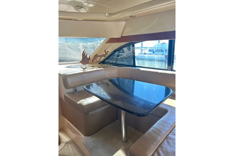 Slide: The Image of Luxurious interior of 2007 Meridian 411SB yacht with elegant dining area and large windows. - 51