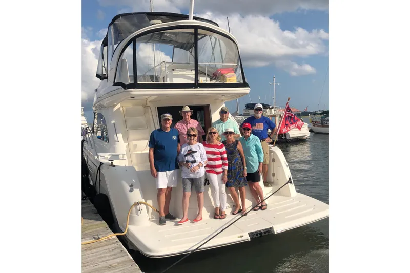 Slide: The Image of Group of people on a 2007 Meridian 411SB yacht at a marina. - 7