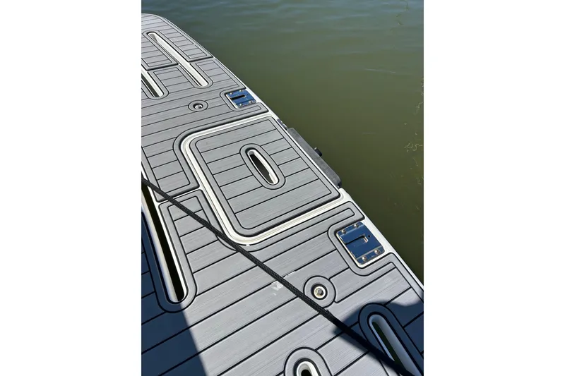 Slide: The Image of 2007 Meridian 411SB boat deck with sleek, modern design and water view. - 8