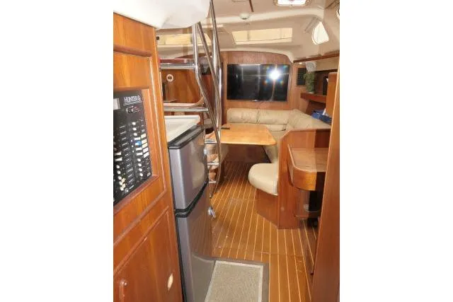Slide: The Image of Interior of 1999 Hunter 450 Passage yacht with wood finish and modern amenities. - 11